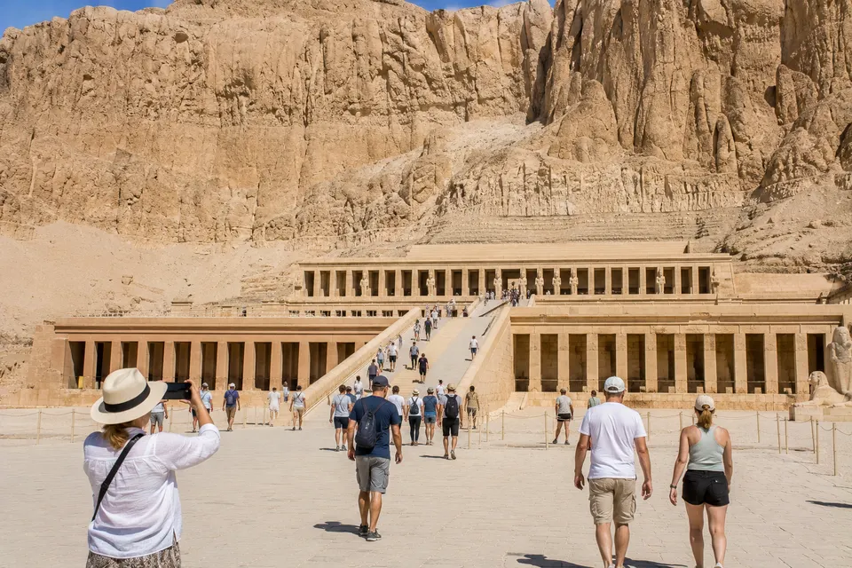 Tourists photographing the terraces of the Temple of Hatshepsut