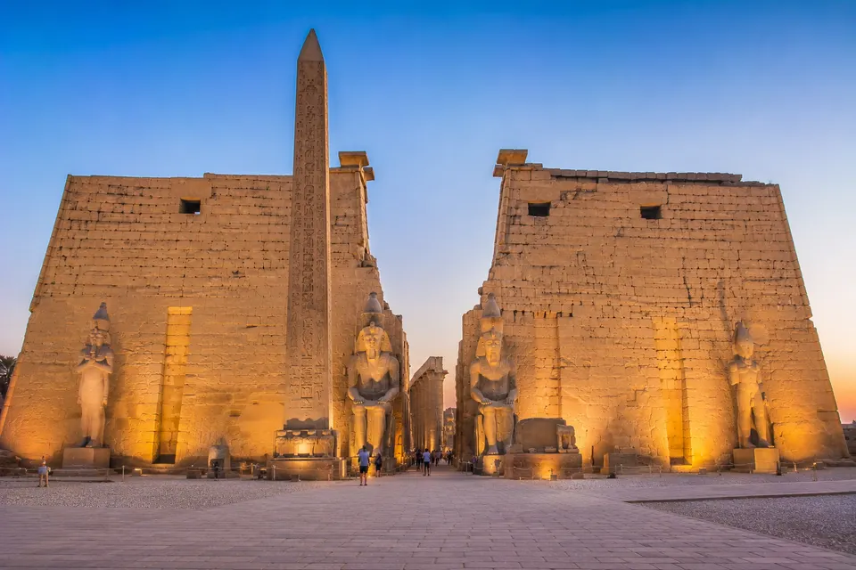 Luxor Temple pylon illuminated at twilight