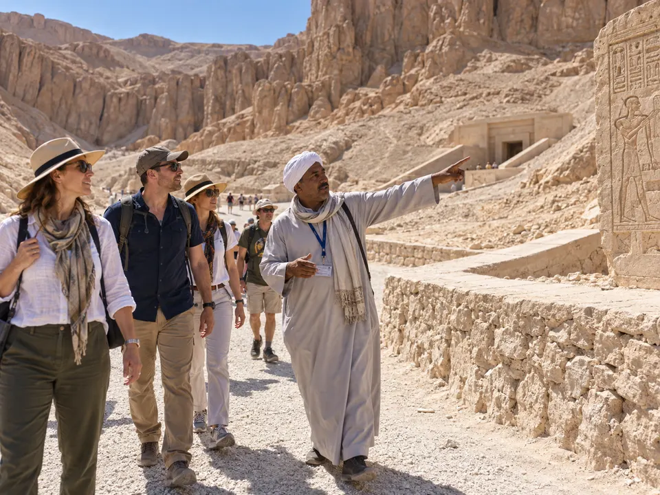 Guide pointing out tombs in the Valley of the Kings